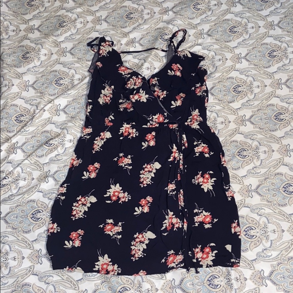 Blossom Romper with a button near chest area